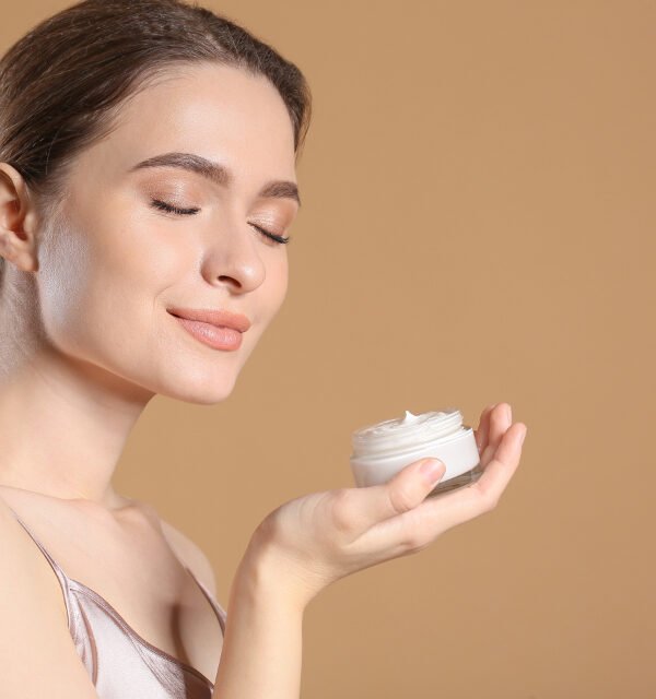 Woman holding luxury face cream