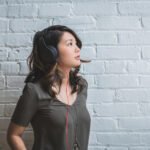 Woman listening music wall