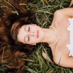 Woman pearl necklace grass