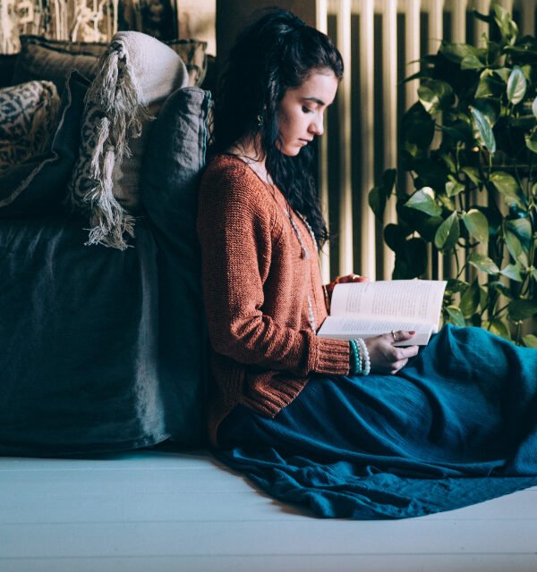Woman reading self help book