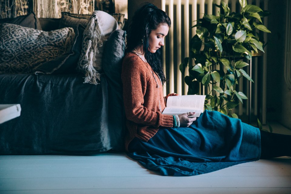 Woman reading self help book