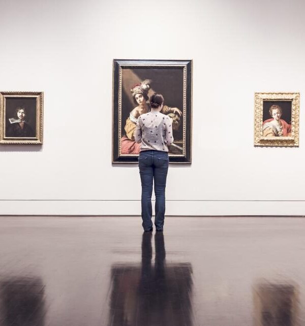 Woman viewing museum painting