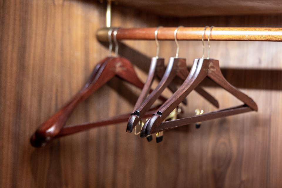 Wooden hangers in a capsule wardrobe for understated style
