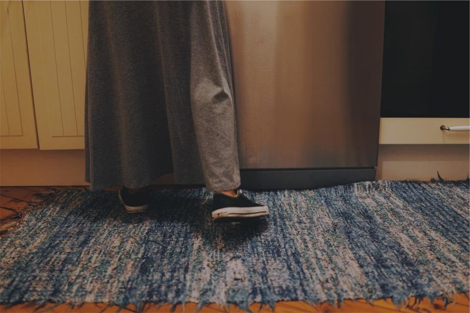 Living room area rugs with woven blue texture underfoot